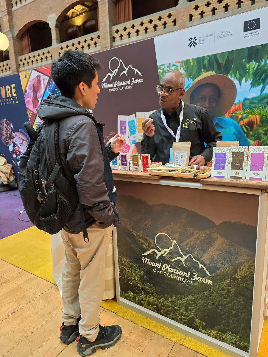 Averell French from Mount Pleasant Chocolate speaking with a buyer during the trade show.