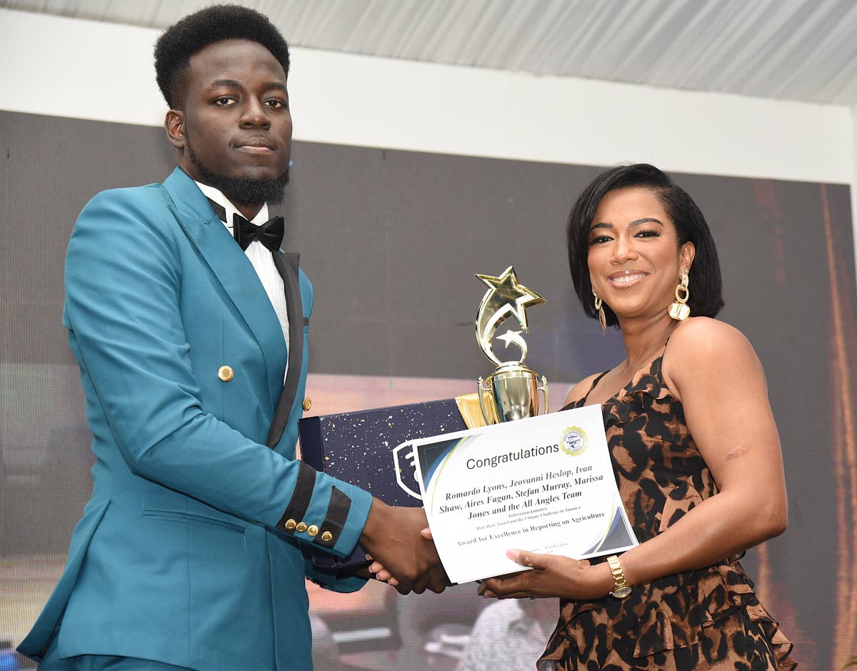 Romardo Lyons (left) of Television Jamaica accepts the Award for Excellence in Reporting on Agriculture from Tyheissa Williams, brand and corporate PR manager at Red Stripe (right). The award was shared with Jeovanni Heslop, Ivan Shaw, Aires Fagan, Stefan 