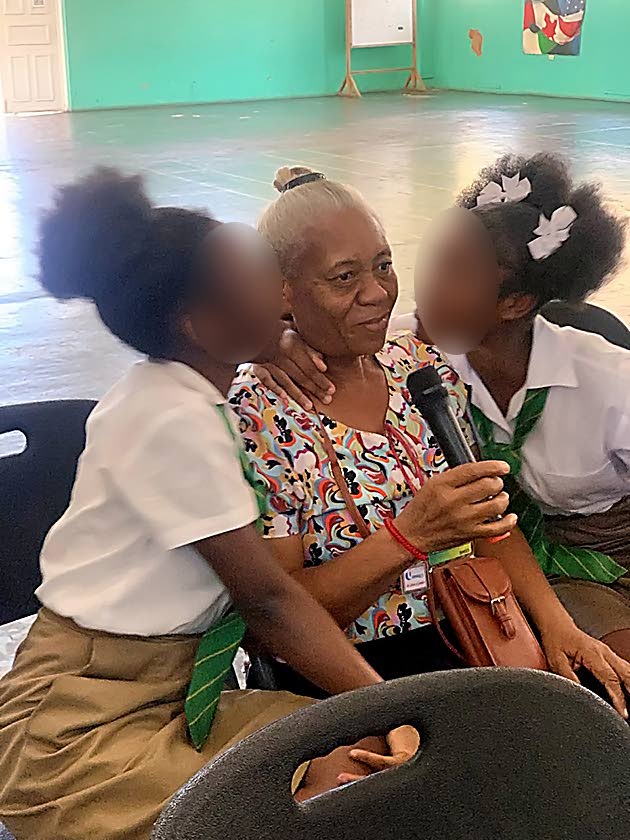 Students of Belair High School embrace their guardian. 