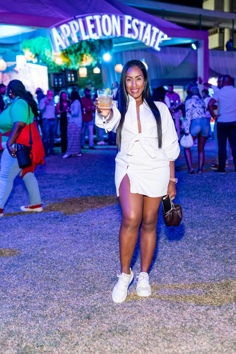 Allison Callam, sales and marketing director, VIP Attractions, shows off her crisp, relaxed style as she poses for the camera with a cocktail in hand. 