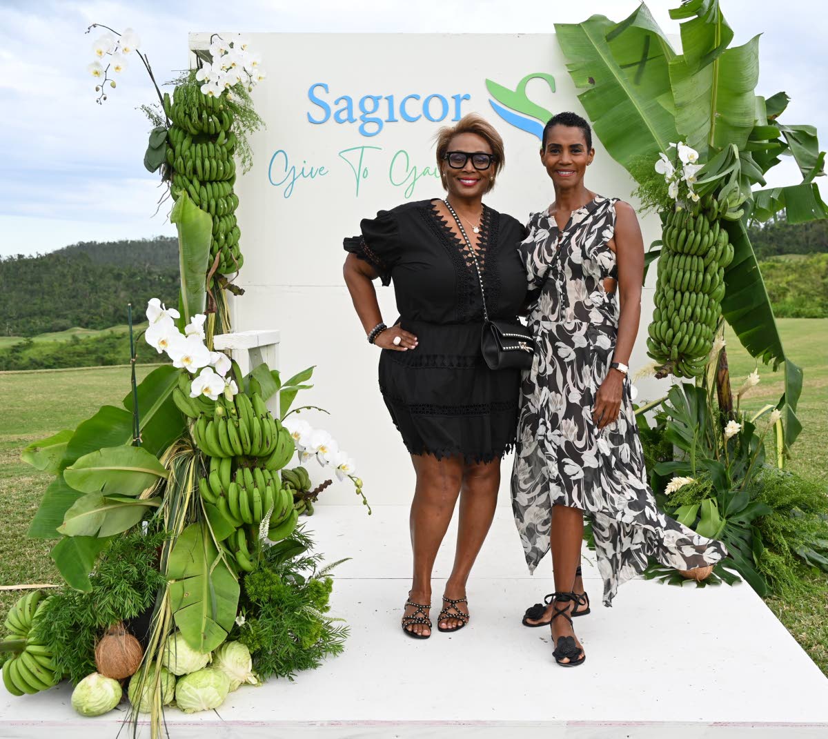 Julia Brown (left), chief executive officer of JMB Legacy Consulting, and Issia Madden, managing director of Design HQ, strike a pose at the Her Farm to Your Table Brunch held on Sunday.