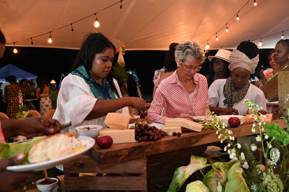 Guests help themselves to the cheese spread at the Her Farm to Your Table Brunch, held on Sunday at the White Witch Golf Course in Montego Bay.