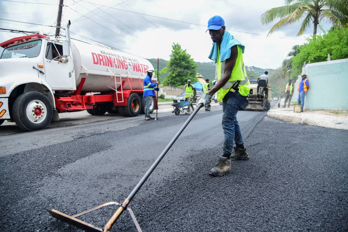 A team from the National Works Agency paves the intersection of Patrick Drive and Auburn Terrace in St Andrew in 2024.