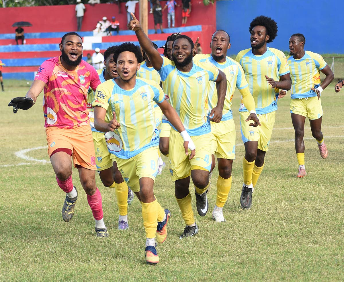 
Waterhouse FC’s Mario Simms (front) celebrates with teammates after scoring against Portmore United during their Jamaica Premier League football match at Ferdi Neita Park Sports Complex on March 5.
