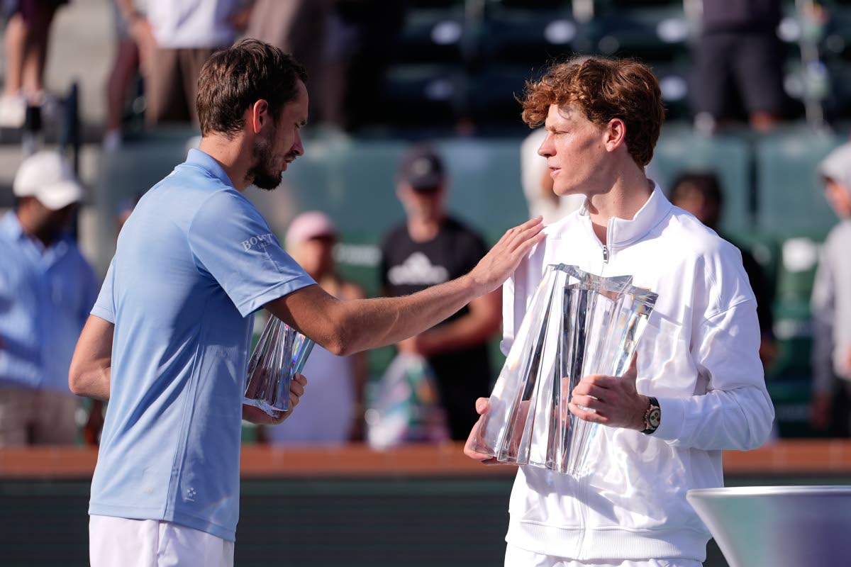 Jannik Sinner (right) of Italy is congratulated by Russia's Daniil Medvedev after Sinner won the BNP Paribas Open tennis tournament, Sunday, March 15, 2026, in Indian Wells, California