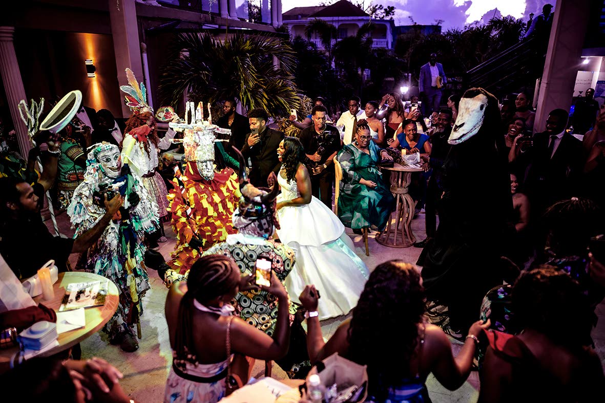 The bride, Kelsey-Jo (centre) experienced the most surreal moment when Jonkunnu accompanied her and the groom during their entrance as husband and wife.