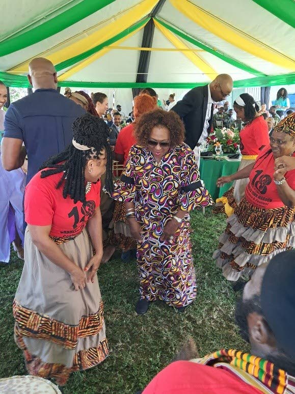 Minister of Culture, Gender Entertainment and Sport, Olivia Grange dances in celebration of the African Houses along with the Charles Town Maroons. 