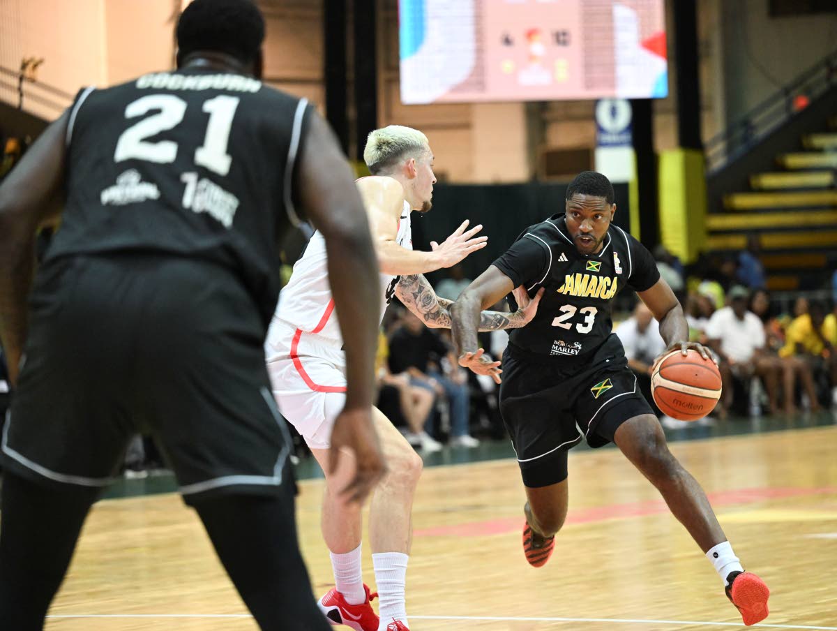 New NBL ‘money chairman’ Chris Williams was inspired by FIBA World Cup action at the National Indoor Sports Centre at the end of February. Here, Canada’s Kyle Wiltjer (centre) gets a hand on Jamaica’s Tyran De Lattibeal at the National Indoor Sport