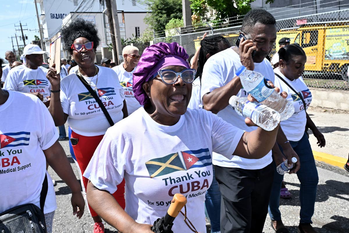 Supporters participate in the Gratitude Walk from Hanover Street to Heroes Circle in Kingston yesterday, showing appreciation to Cuban medical professionals for their 50 years of medical support to the Jamaican people.