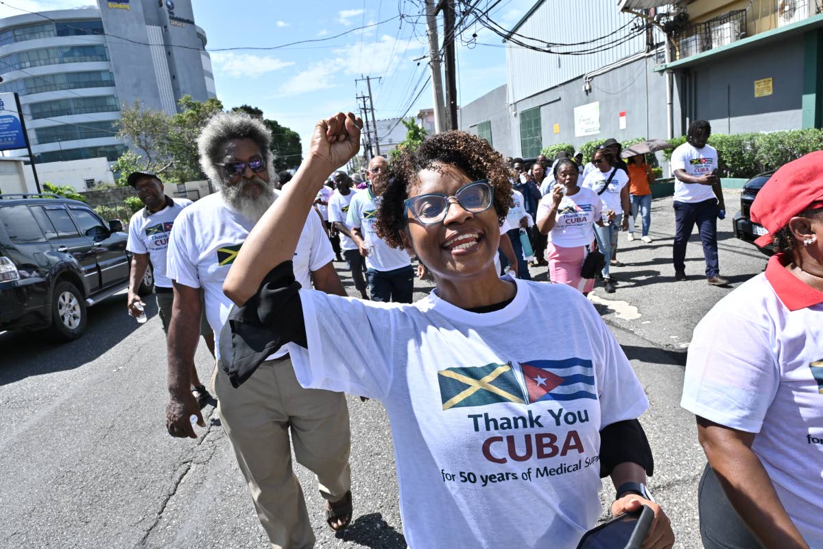 Dr Louis Moyston (left), lecturer in the Department of Government at The University of the West Indies, and Stacey Knight (right), attorney-at-law, with participate in the Gratitude Walk.