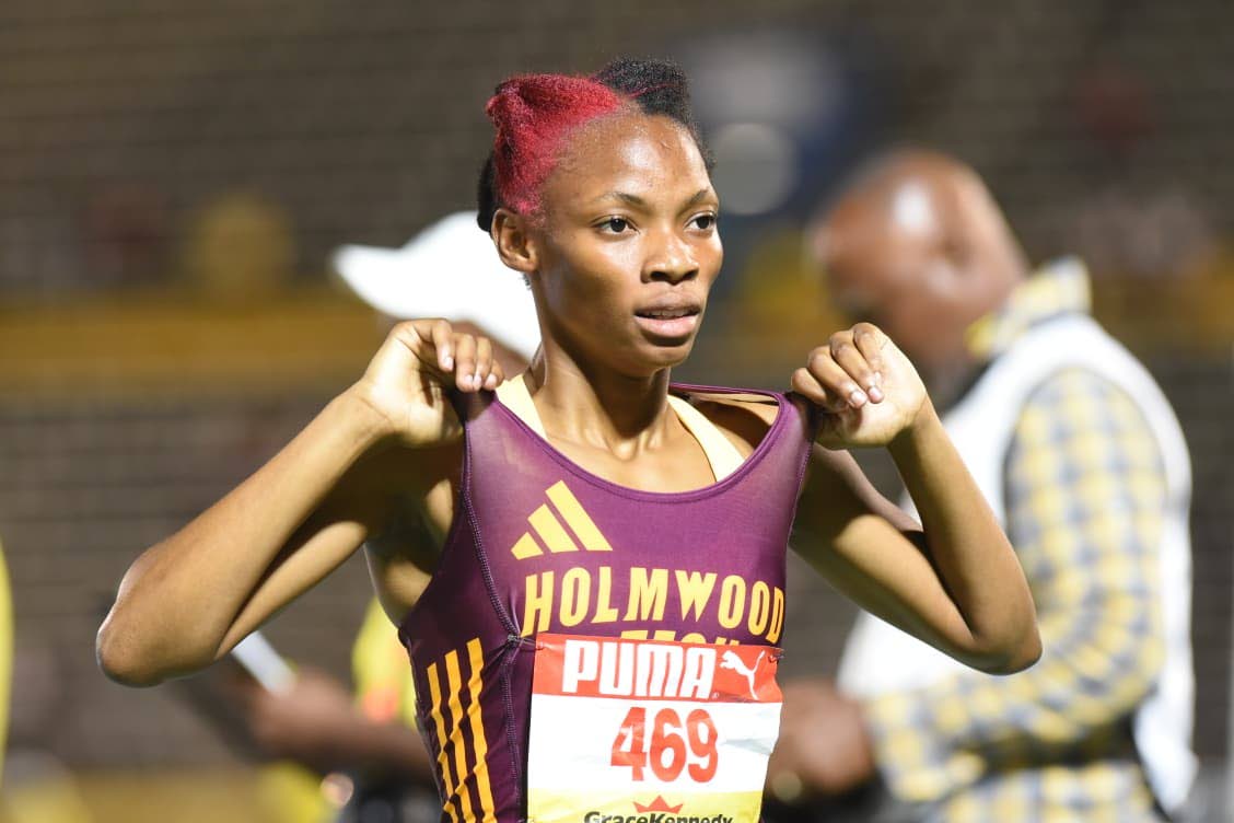 Jovi Rose of Holmwood Technical celebrates after winning the Class One girls’ 1500 metres at the ISSA/GraceKennedy Boys and Girls’ Athletics Championships at the National Stadium on Wednesday.