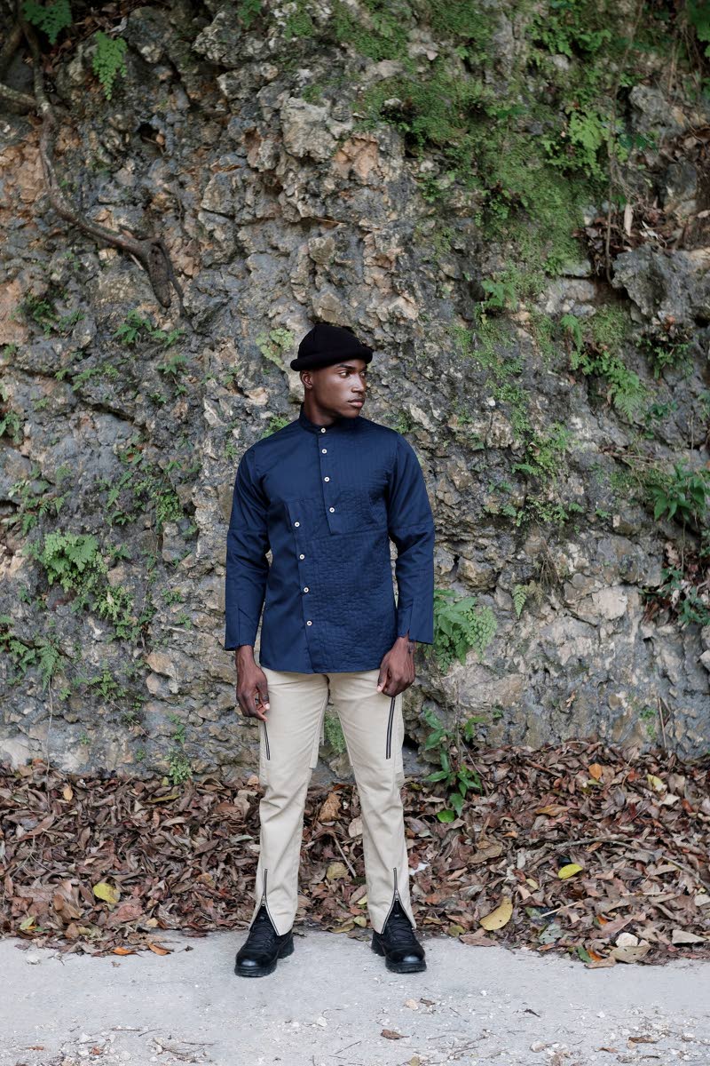 In the hue of midnight blue, this long-sleeve cotton shirt features inward pintuck detailing as well as a Mandarin collar and coconut shell button closure.