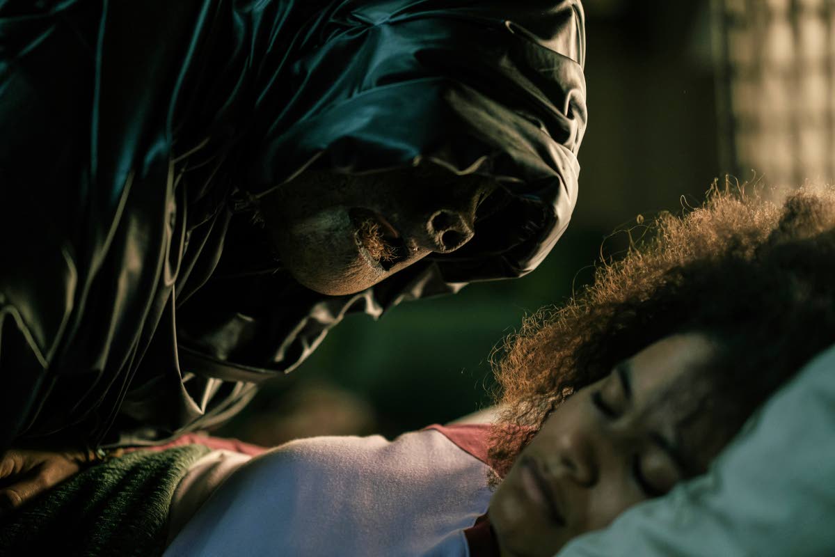This image released by Warner Bros. Pictures shows a sleeping Zazie Beetz in a scene from ‘They Will Kill You’.
