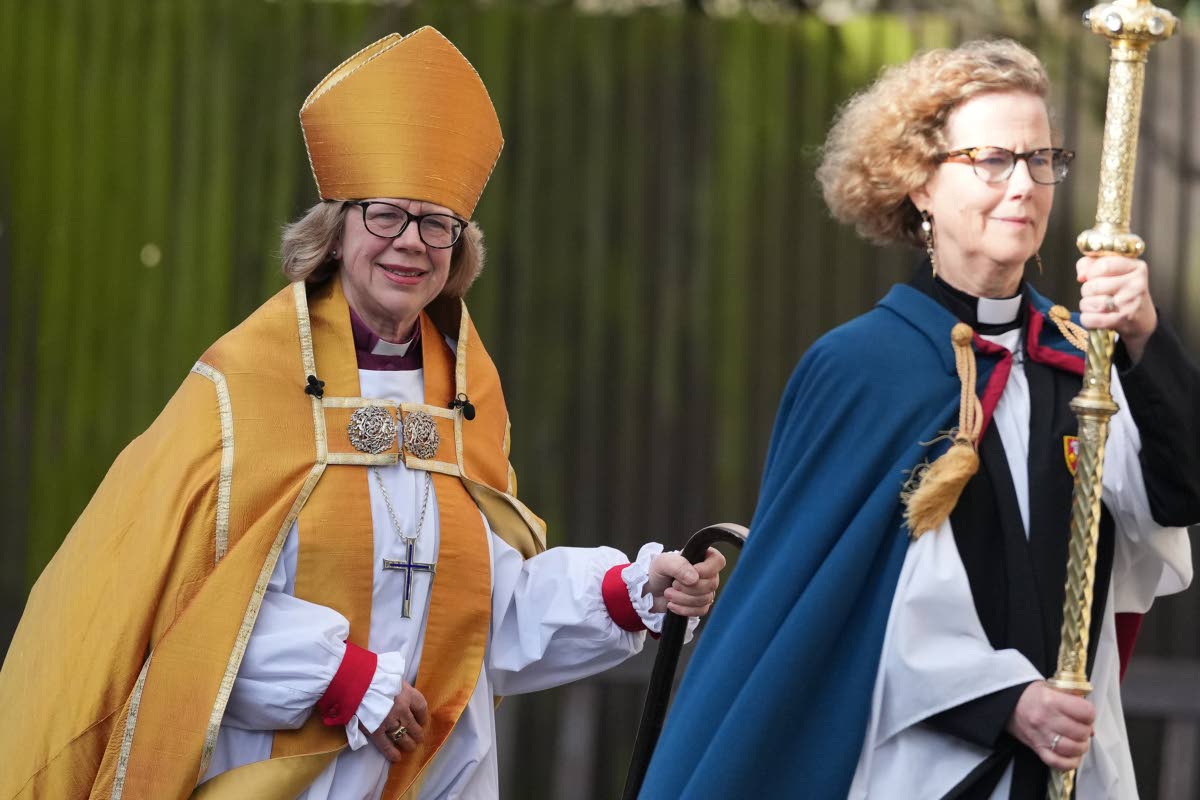 Sarah Mullally, left, arrives for the Enthronement Ceremony installing her as archbishop of Canterbury in Canterbury, England, Wednesday, March 25, 2026, the first woman ever to lead the Church of England.