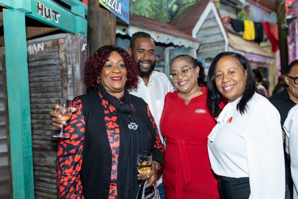 (From left) Shane Warren Walters, manager, client partnership, JMMB Group; Lisa-Gaye Belcher, financial partnership manager, JMMB Group; Trevor Burnett Jr (second left) and Madge Neil Burnett, proprietors, Greenwood Plaza, at the JMMB Group client mixer Co
