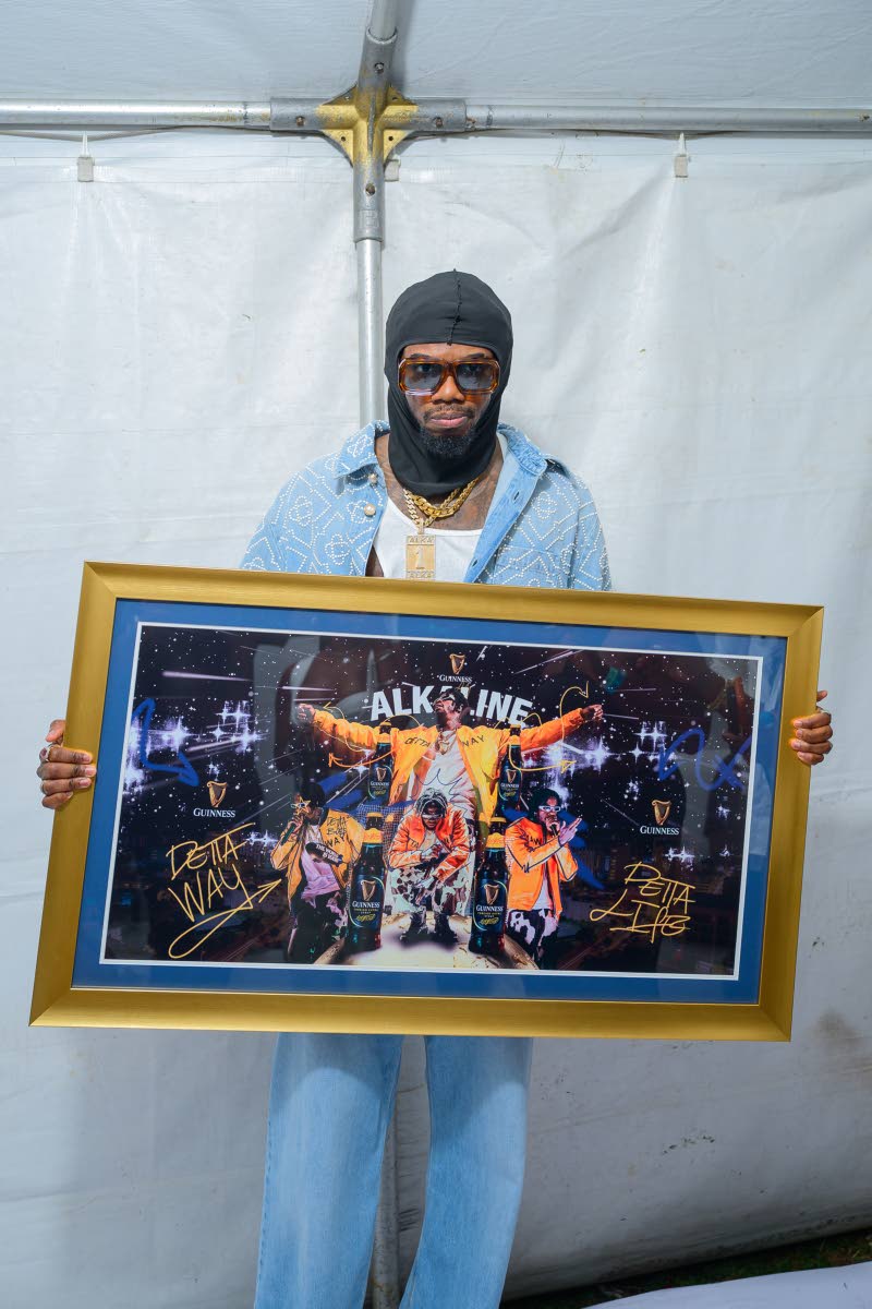 Alkaline stands proud with his commemorative Guinness-sponsored plaque, cementing his place as a true champion of dancehall culture.