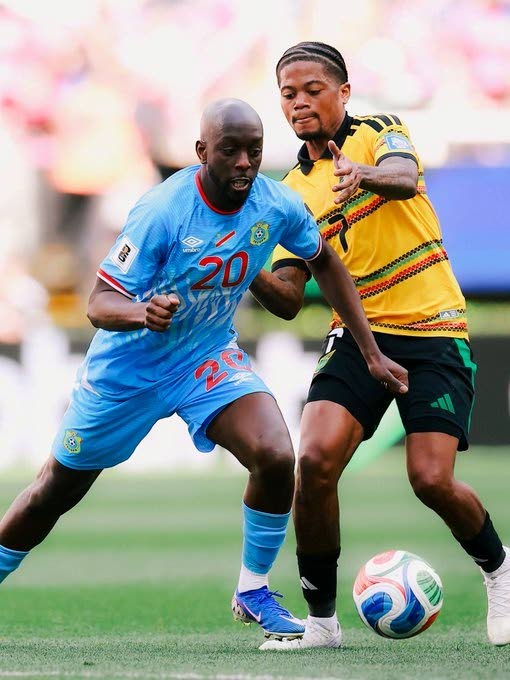 Jamaica's Leon Bailey (right) and Yoane Wissa of the Democratic Republic of Congo (DR Congo) battle for the ball during an Inter-continental World Cup playoff final in Guadalajara, Mexico. 