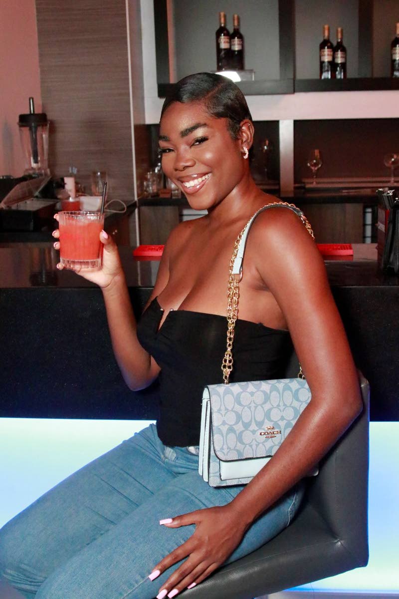 Alicia Sewell is every bit alluring in an off-the-shoulder top paired with jeans.