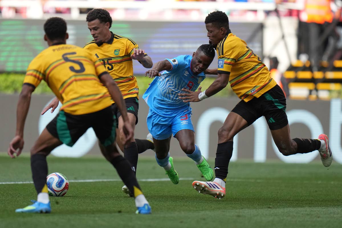 Jamaica’s Richard King (right) challenges DR Congo’s Brian Cipenga (second right) during the World Cup play-off final match in Guadalajara, Mexico, on Tuesday.