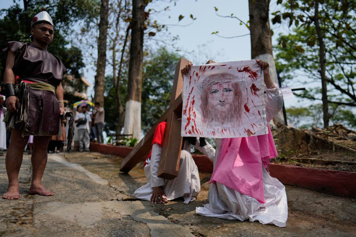 Christians reenact the crucifixion of Jesus Christ in Guwahati, India, on Good Friday.