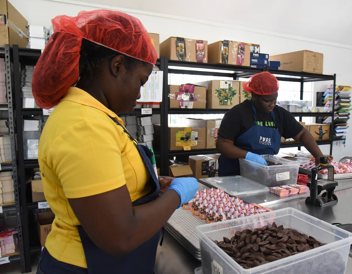 Workers at the Pure Chocolate factory in Ocho Rios, St Ann, wraps chocolate for the market.