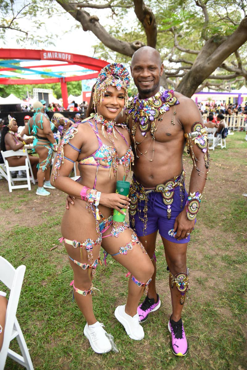 Joining the road vibes at lunchtime, sprint icon Asafa Powell, clad in Nova, poses with his forever plus-one, Alyshia Miller-Powell. 