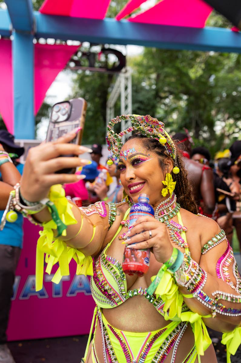 Marsha Douglas, in Jamaica from Florida for carnival, is captured by our lens as she takes a selfie.