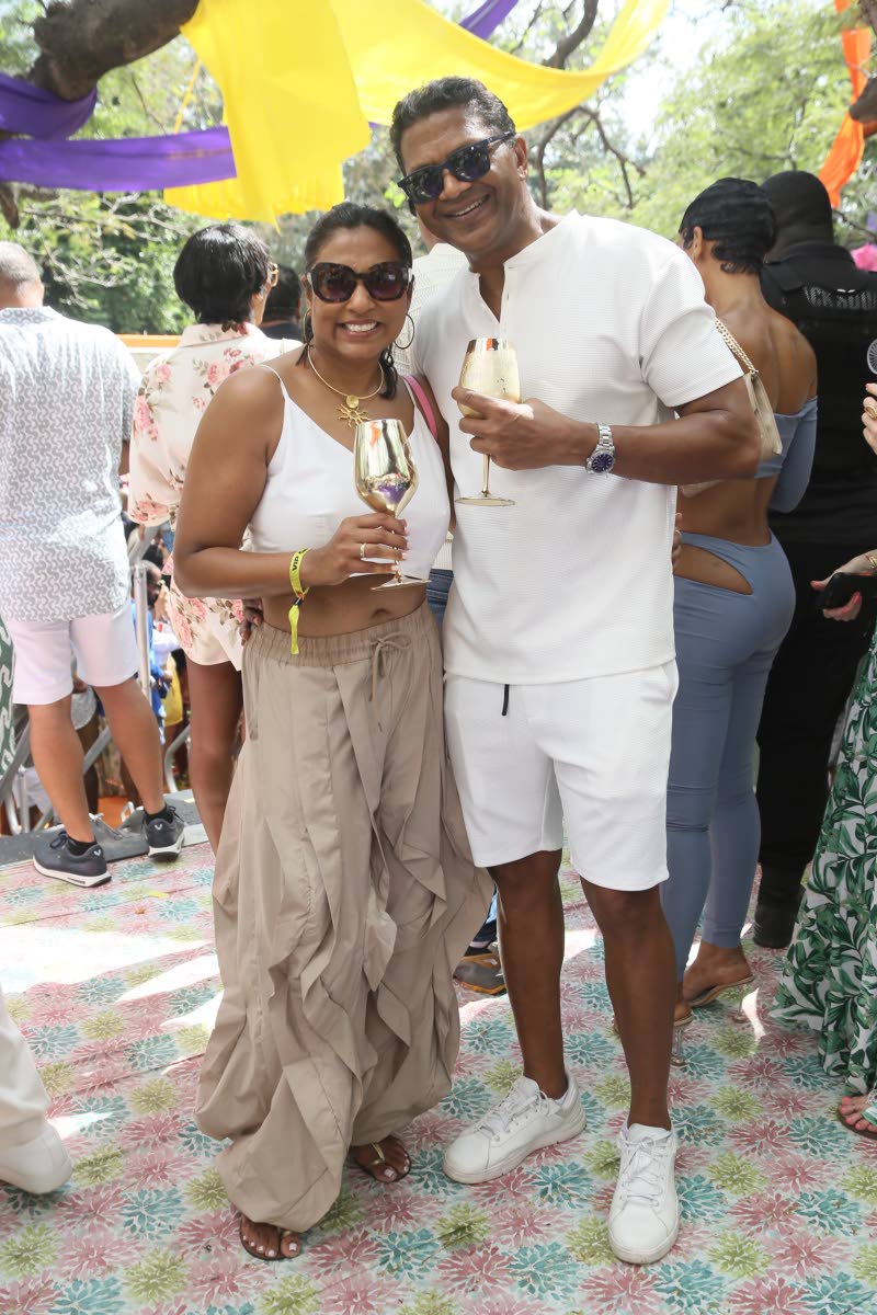 Richard Pandohie, chief executive officer of Seprod, and his wife, Nicole Pandohie, director of the Jamaica Food and Drink Kitchen, keep it classic in coordinated neutral tones.