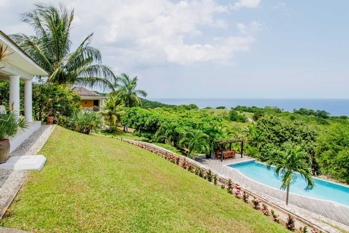 
The pool and pergola sit below the main house.