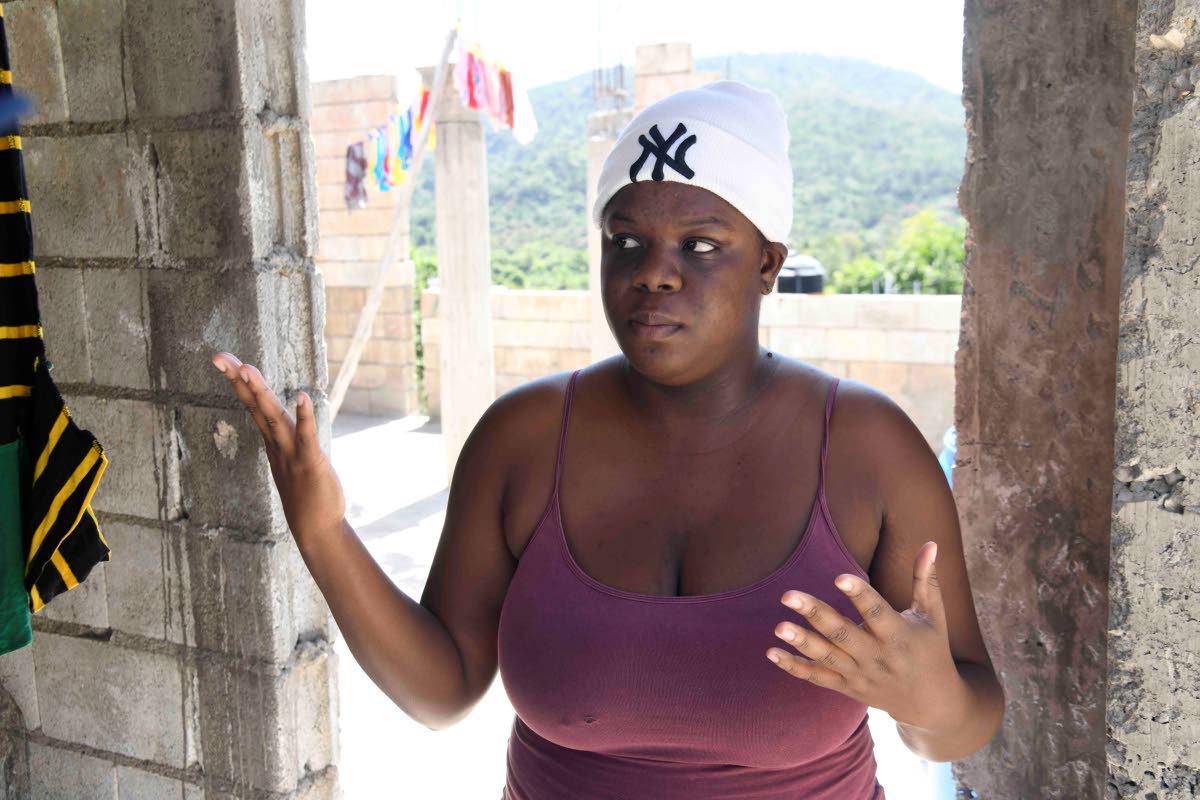Twenty-four-year-old Tehillah Duncan recalled her days carrying water up the hill from a nearby standpipe for domestic uses before her parents bought a tank. 