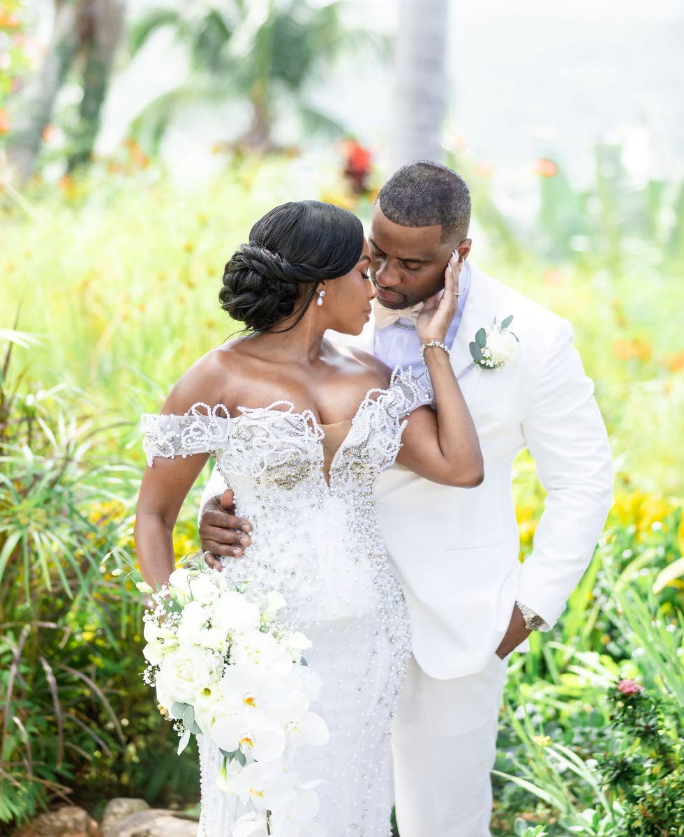 Stacia and Rashaan Robinson share a sweet embrace.