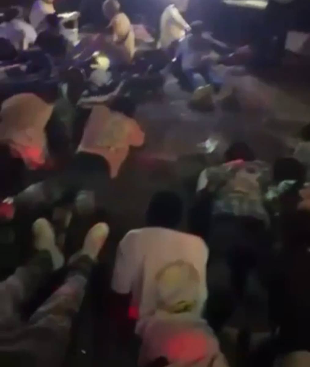 Patrons lay flat in a Mt James, St Andrew venue as directed by police. The lawmen swooped down on the venue in search of wanted men and illegal firearms.