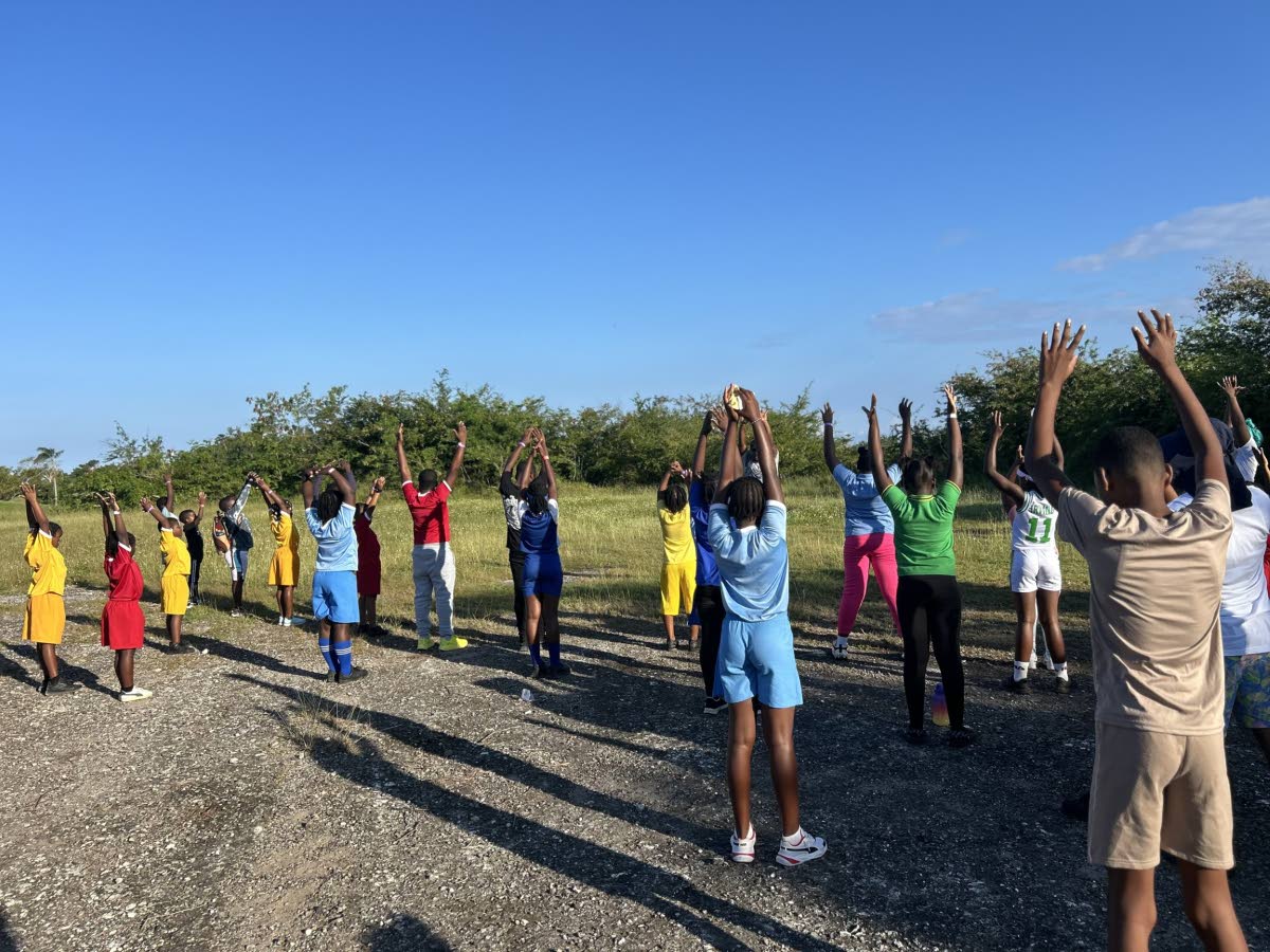 Sheffield Primary students participate in a cool‑down exercise following the 2K walk/run. 