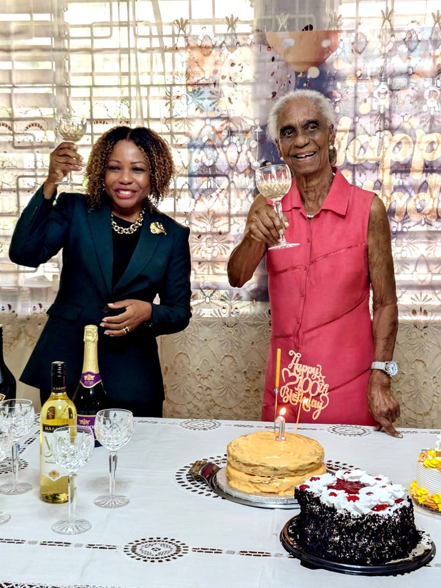 Minister of Education, Skills, Youth and Information, Senator Dr Dana Morris Dixon (left), celebrates with former education minister Dr Mavis Gilmour‑Petersen during an event marking Gilmour‑Petersen’s 100th birthday at her St Andrew home on April 16