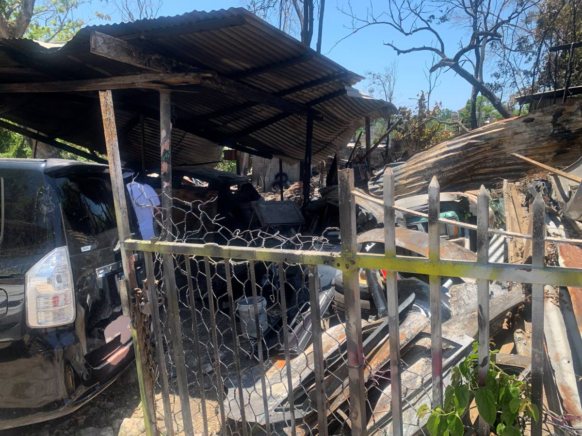 A section of a bodywork shop along Sun Valley Road in Glendevon, St James, damaged by a fire on Tuesday.