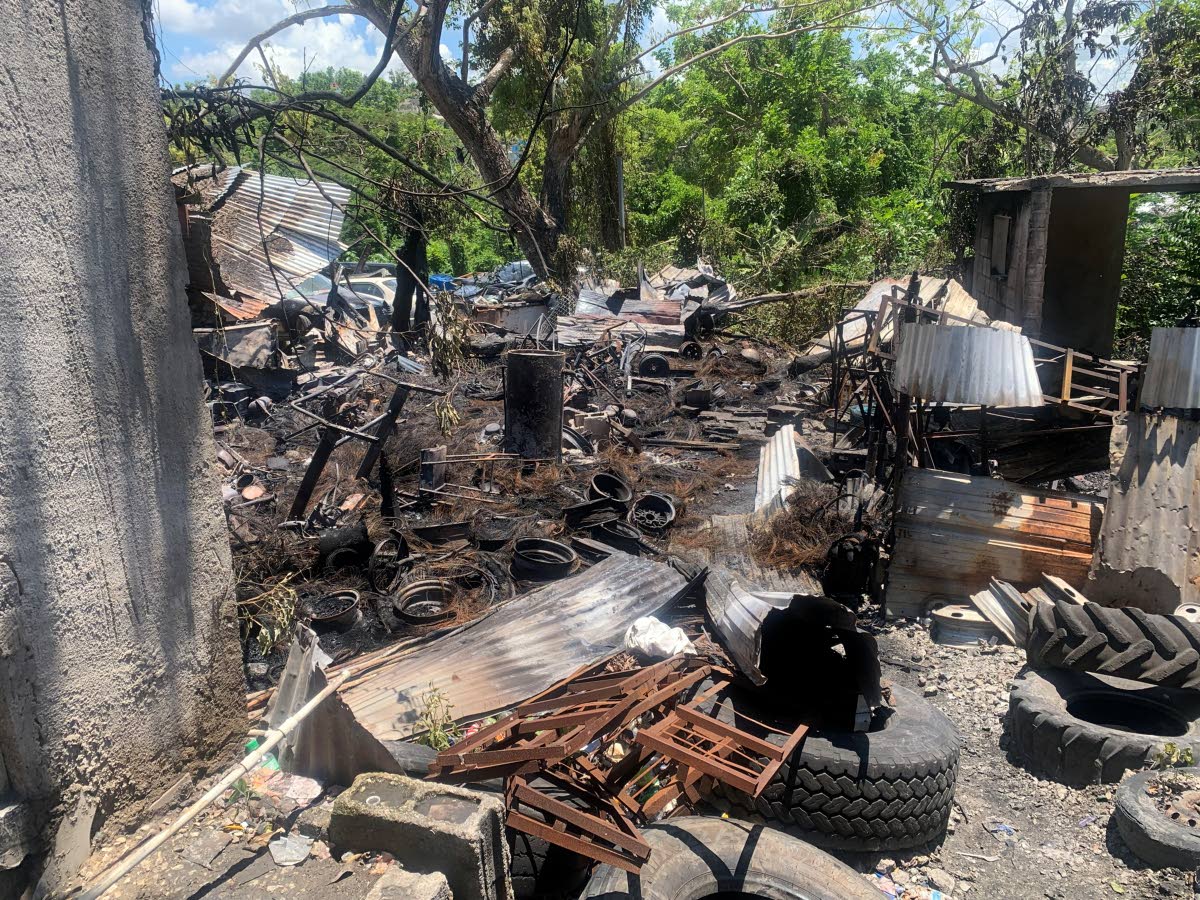 Damage is seen at the tyre shop owned by Canute ‘Tyre Doctor’ James after a fire. 