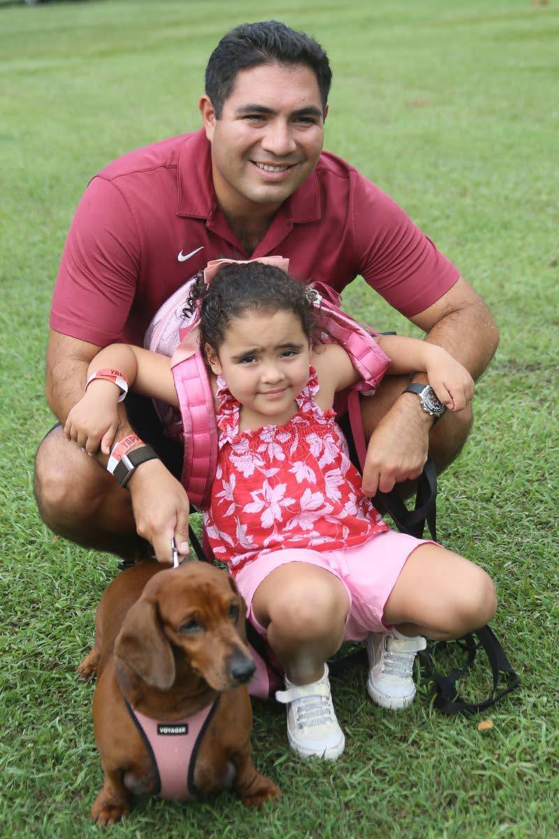 Little Alia Ammar excitedly ran over to her dad, Michael Ammar, executive director of CTI Limited, to snap a sweet moment with their Dachshund, Tala.