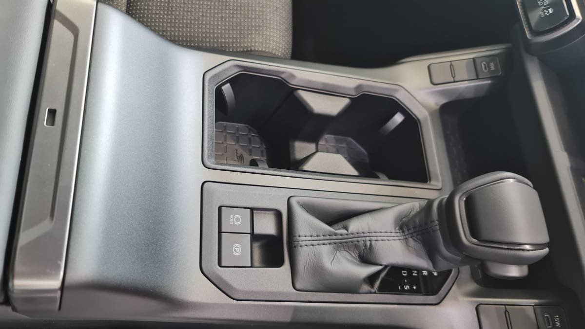 Precision meets ergonomics in the redesigned center console, where the sleek shifter serves as the gateway to the RAV4’s seamless automatic and hybrid transitions.