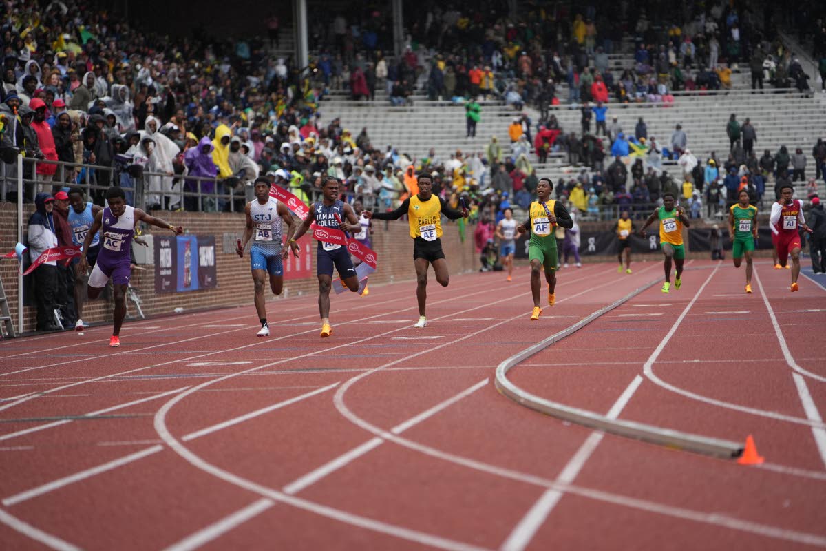 
Jamaica College’s Kai Kelly (third left) anchors his team to victory in the boys’ Championships of America 4x100-metre relay at the Penn Relays inside the Franklin Field Stadium in Pennsylvania yesterday. 