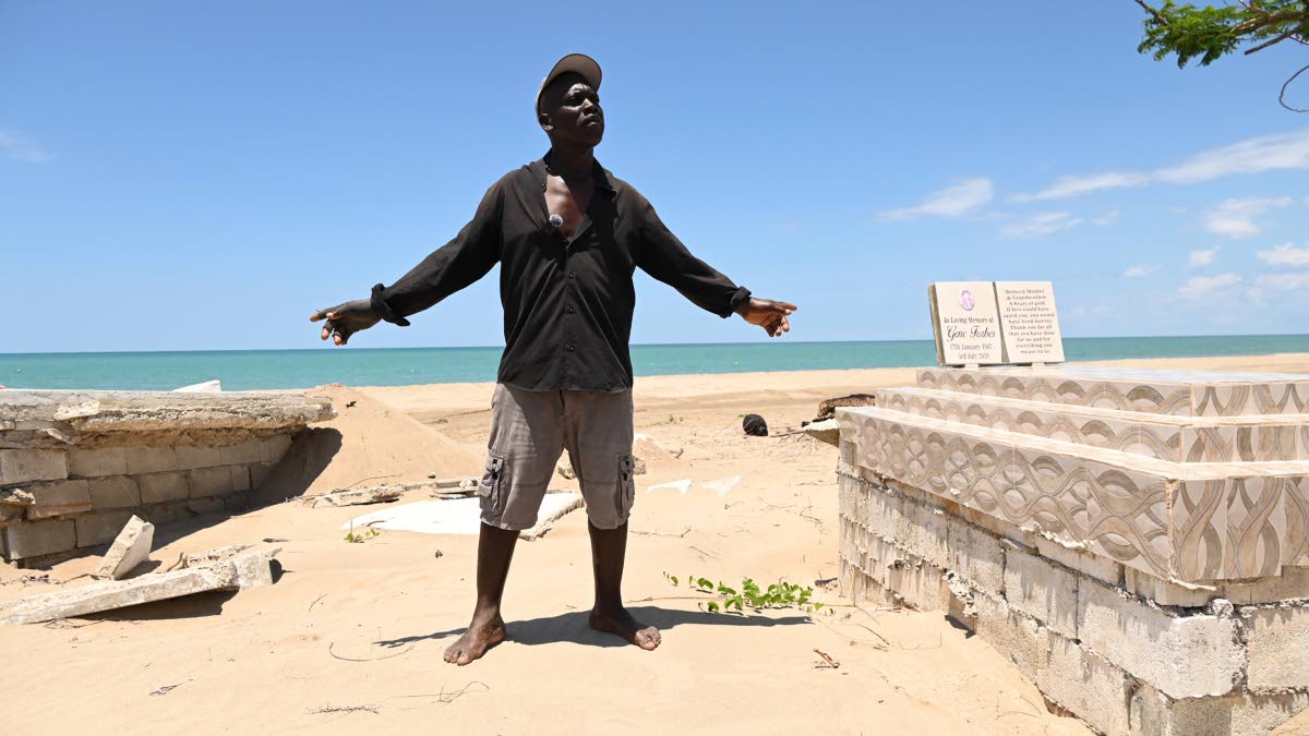 Michael Kelly shows two of the four graves that were damaged during the passage of Hurricane Melissa almost six months ago at Parottee in St Elizabeth last Wednesday.