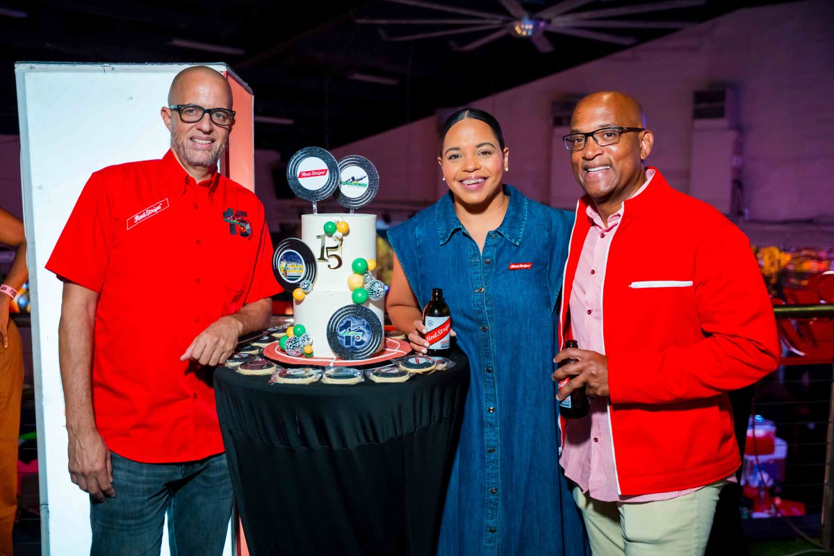 What’s a party without cake? Gathering for a photo ahead of the cake-cutting are (from left) Nicholas Taylor, managing director of Usain Bolt’s Tracks and Records; Amoye Phillpotts-Brown, Red Stripe brand manager and her colleague, Head of Commerce, Se