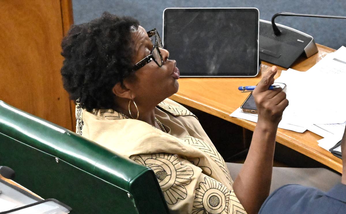 Angela Brown Burke, opposition member of parliament, was suspended from the sitting after being accused of lifting the Mace. 