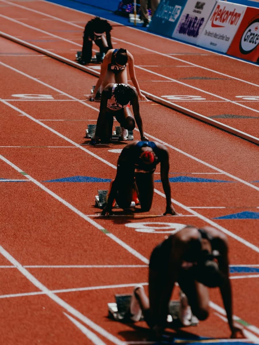 Penn Relays teams await the gun in the girls’ 4x100m.
