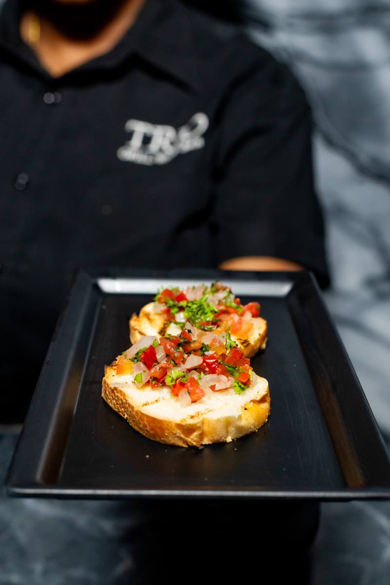 The strawberry and balsamic seduction features roasted strawberries drizzled with aged balsamic, served atop whipped mascarpone on crisp crostini. 