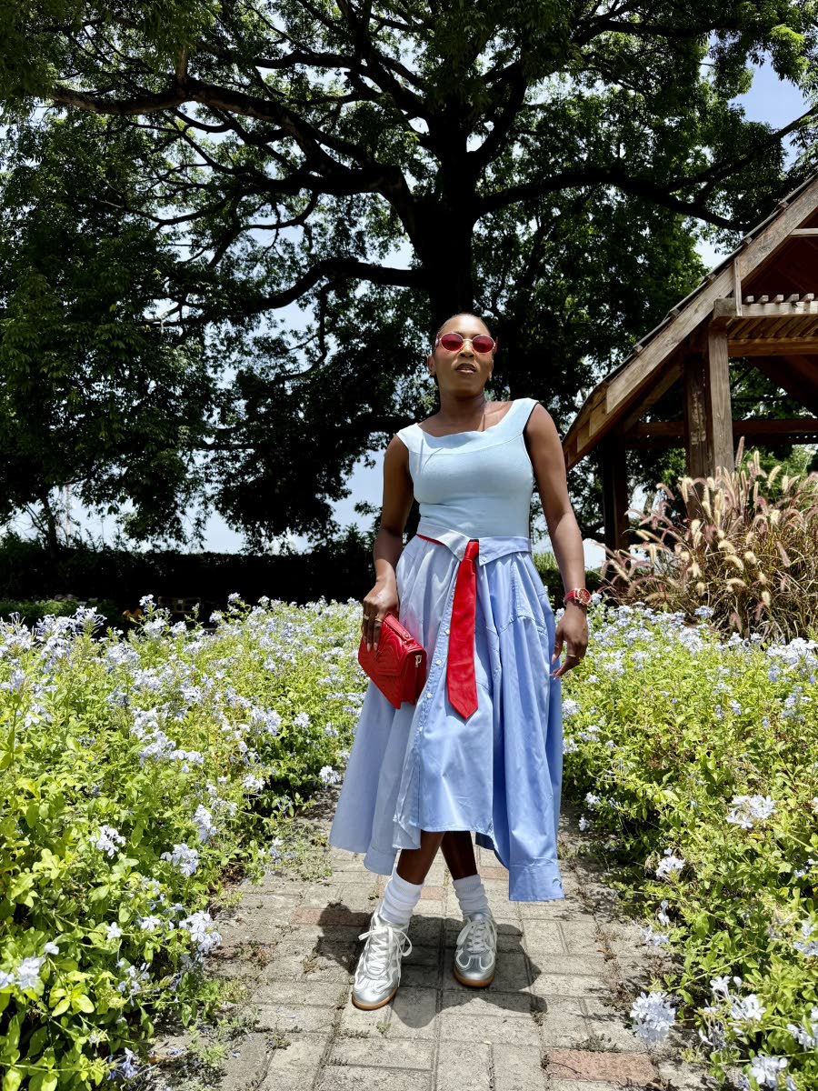 Above: A playful twist on modest dressing, this look features a light-blue top from Lee’s Fifth Avenue paired with a deconstructed skirt crafted from two of the retailer’s shirts. A red Heel-O bag and Samba sneakers complete the look.
