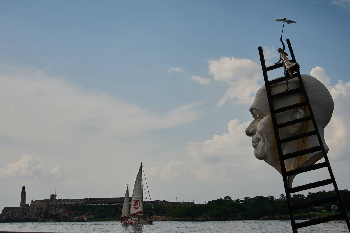 Artwork by Cuban Osmany Betancourt stands on exhibit in Havana Bay where the Astral ship from the Spanish humanitarian organisation Open Arms arrives, in Cuba.