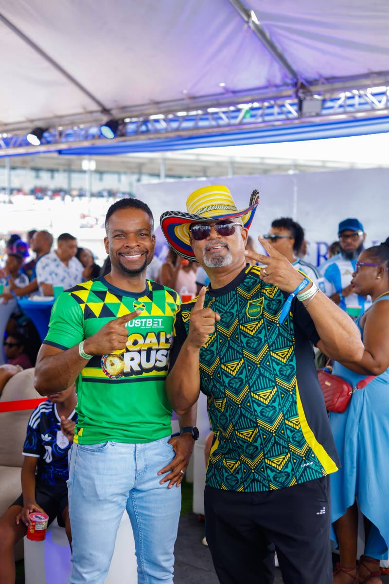  Stefan Miller (left), CEO of Supreme Ventures Gaming, and Michael McMorris, chairman of the board of directors at VM Group, are all smiles at Caymanas Park.