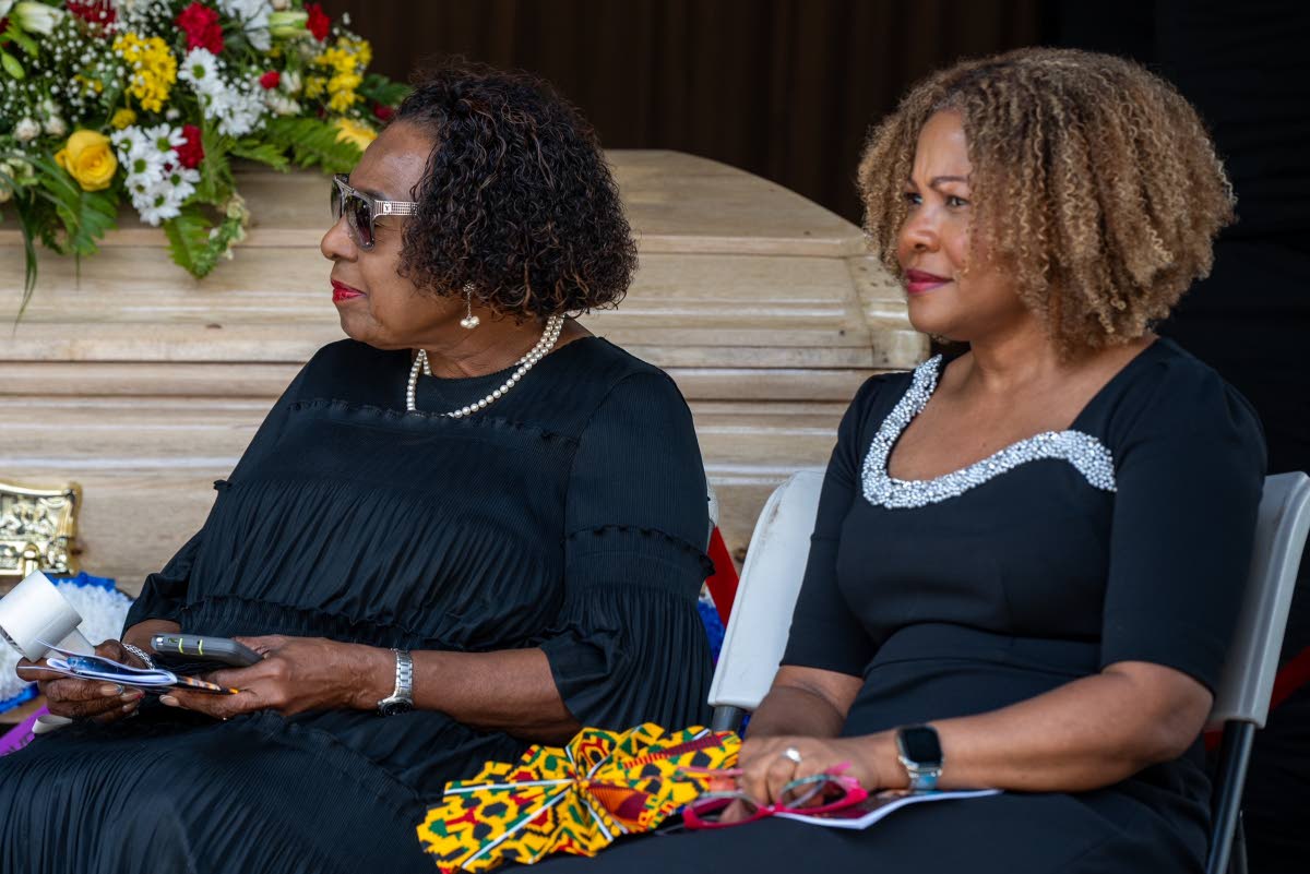Minister of Culture, Gender, Entertainment and Sport Olivia ‘Babsy’ Grange (left) and Minister of Education, Skills, Youth and Information Dana Morris Dixon attend Theodore Wilburn ‘Stranger’ Cole’s thanksgiving service on Wednesday.