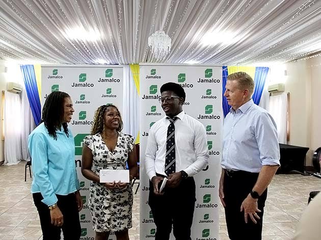 From left: Donna Marie Brooks, Jamalco’s manager of corporate communications and public relations; Century Aluminum scholarship recipients Shakila Stewart and Marvin Whyte, both law students at The University of the West Indies; and Adriaan Strydom, Jama