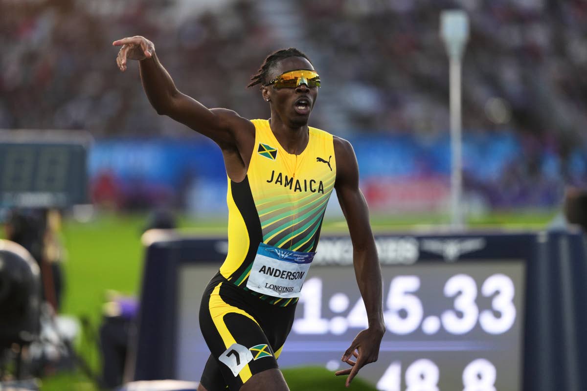 Navasky Anderson, of Jamaica, celebrates after crossing the finish line to win the men’s 800 meters at the Commonwealth Games in Glasgow, Scotland, yesterday.